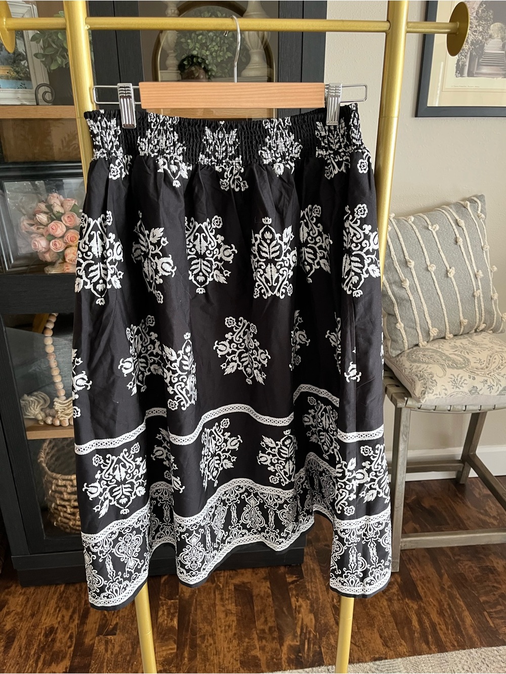 CeCe cotton poplin A-line midi skirt in black with a white botanical print. - Picture 2 of 7